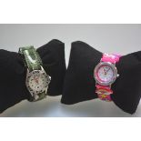Travel boys and girls quartz wristwatches on adjustable straps complete with boxes etc (2). Dials