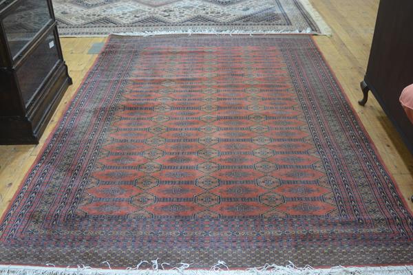 A Faran Super wool carpet of Bokhara design, with three rows of octagons enclosed within a