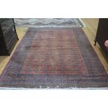 A Faran Super wool carpet of Bokhara design, with three rows of octagons enclosed within a