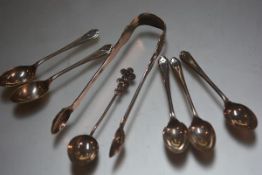 A pair of George Adams Victorian London silver Fiddle and Shell pattern sugar nips, a set of five