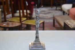 A 1930s style chromium plated cast brass, Female Figure with Arms Outstretched, raised on stepped