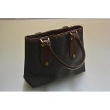 A Mulberry embossed canvas and leather bag with twin loop handles and brass hardware (unused) (h.