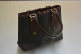 A Mulberry embossed canvas and leather bag with twin loop handles and brass hardware (unused) (h.