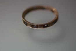 A 9ct gold clear stone set eternity style ring, (one stone lacking), 1.7grams, size M