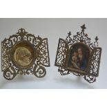 Two engraved and pierced brass devotional frames, late 19th century, each fitted with a pair of