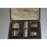 A Mappin & Webb six piece table condiment set comprising two salt cellars, two pepperettes and two
