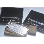 Two chromium plated drawing sets, cased, a Rolls razor cased with fittings and an Avery 1lb