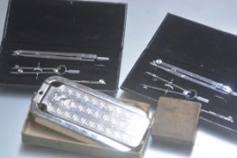 Two chromium plated drawing sets, cased, a Rolls razor cased with fittings and an Avery 1lb