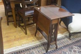 An Edwardian mahogany Sutherland tea table, with satinwood strung border, on pierced trestle