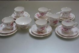 A Tuscan China Fragrance pattern twenty piece teaset with transfer printed enamel floral sprays,