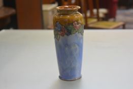 A Royal Doulton Lambeth Pottery tapered cylinder vase with peony and leaf tublined border with brown