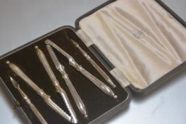 A pair of Mappin & Webb lobster/crab cracks and picks in original fitted case