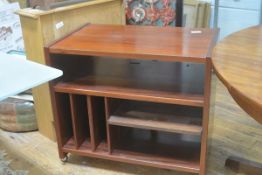 A 1960's rosewood music system stand, with open shelves, slatted sides and lift up panel top. 70cm