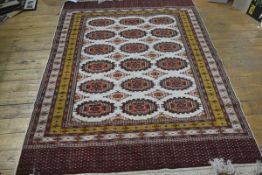 A finely knotted Turkoman rug, the centre panel with three rows of octagons, enclosed within a
