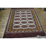 A finely knotted Turkoman rug, the centre panel with three rows of octagons, enclosed within a