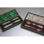A pair of mother of pearl handled Epns butter knives and a pair of mother of pearl handled jam