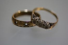 A 9ct gold eternity style ring (missing stones) and a 9ct gold three stone illusion set diamond