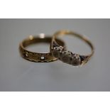 A 9ct gold eternity style ring (missing stones) and a 9ct gold three stone illusion set diamond