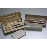 A Parker 51 propelling pencil and fountain pen set with box and papers; tog. with a Parker 61