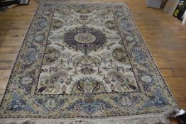 A Turkoman rug, the centre medallion with radiating lotus leaf and flower design enclosed within a