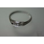 A platinum and diamond two stone ring (one stone lacking), size J. 1.37 grams