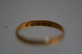 A 22ct gold wedding band. Total 1.9 grams