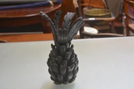 A treen segmented pineapple with dark stain finish (h.33cm x 12cm)