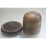 A hatmaker's treen sectional oval mould (h.19cm x 17cm x 16cm) and a treen ebonised dome stand (d.