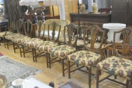 A set of six plus eight Hepplewhite style wheatsheaf shield back mahogany dining chairs with