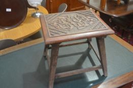 An Edwardian relief carved top stool with Celtic style dragon intertwining knot figures (h 28cm x
