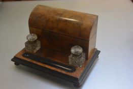 A Victorian burr walnut and ebonised desk stationery rack inkstand complete with arched top