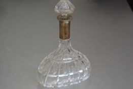 A crystal oval faceted cut decanter with white metal mounted stopper, stamped 800 (h.28cm)