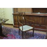 An Edwardian mahogany inlaid open spar back armchair with inset seat, raised on square tapered