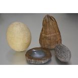 An ostrich egg (h.17cm), an agate dish, a coco pod (l.15cm), and a seed pod (l.19cm)