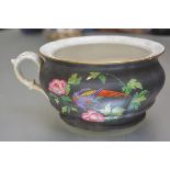A 19thc English china chamber pot with handpainted transfer printed design of exotic bird and