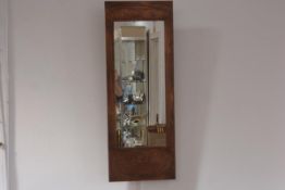 A modern embossed copper Art Nouveau style wall mirror, rectangular. 81cm by 30.5cm