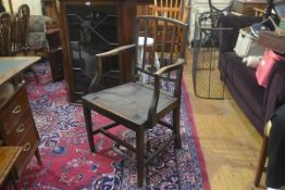 A Georgian elm branderback style open arm side chair with inset rush seat, raised on square