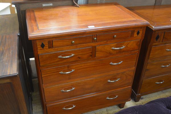 A hardwood and ebony inlaid chest, the rectangular top with moulded edge above a pull out drawer,