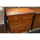 A hardwood and ebony inlaid chest, the rectangular top with moulded edge above a pull out drawer,