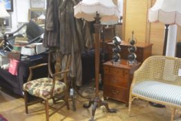 An Edwardian mahogany octagonal swag and tasse1 carved fluted tapered column floor lamp, raised on