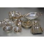 An Epns tea strainer, a collection of plated butter dishes, an Epns condiment set, an hors d'oeuvres