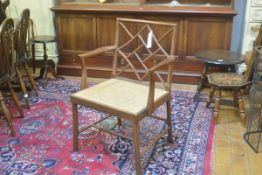 A modern painted walnut finish beechwood cockpen chair with diamond shaped Chinese spar back, with