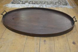 A George III mahogany oval galleried twin brass handled tea tray (h.4cm x 76cm x 49cm) (small