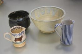 An Ardington pottery ribbed and blue slip decorated bowl (h.9cm x d.18cm), a blue striped pottery