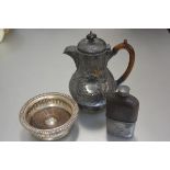 A Britannia metal chased coffee pot with treen handle to side, a circular pierced Sheffield plated