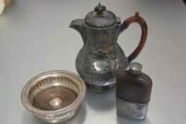 A Britannia metal chased coffee pot with treen handle to side, a circular pierced Sheffield plated
