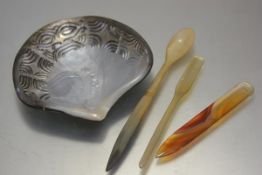 An abalone carved shell (14cm), a horn spoon (l.19cm), a horn marrow scoop, an agate letter