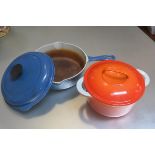 A Le Cruset blue enamelled cast iron saucepan and a Casran cast iron orange enamelled casserole dish