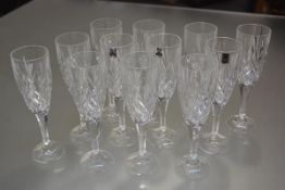 A set of twelve Gleneagles crystal champagne flutes (h.22cm)