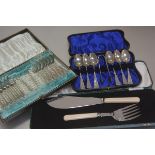A pair of Epns ivorine handled fish servers, a set of six Continental white metal teaspoons and